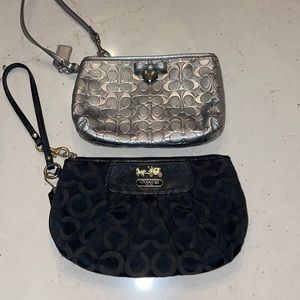 Black and silver Coach wristlets